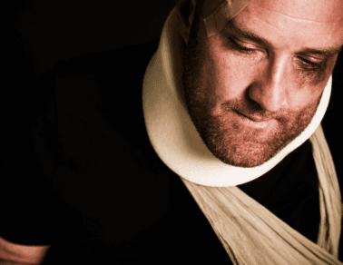 injured guy in neck brace